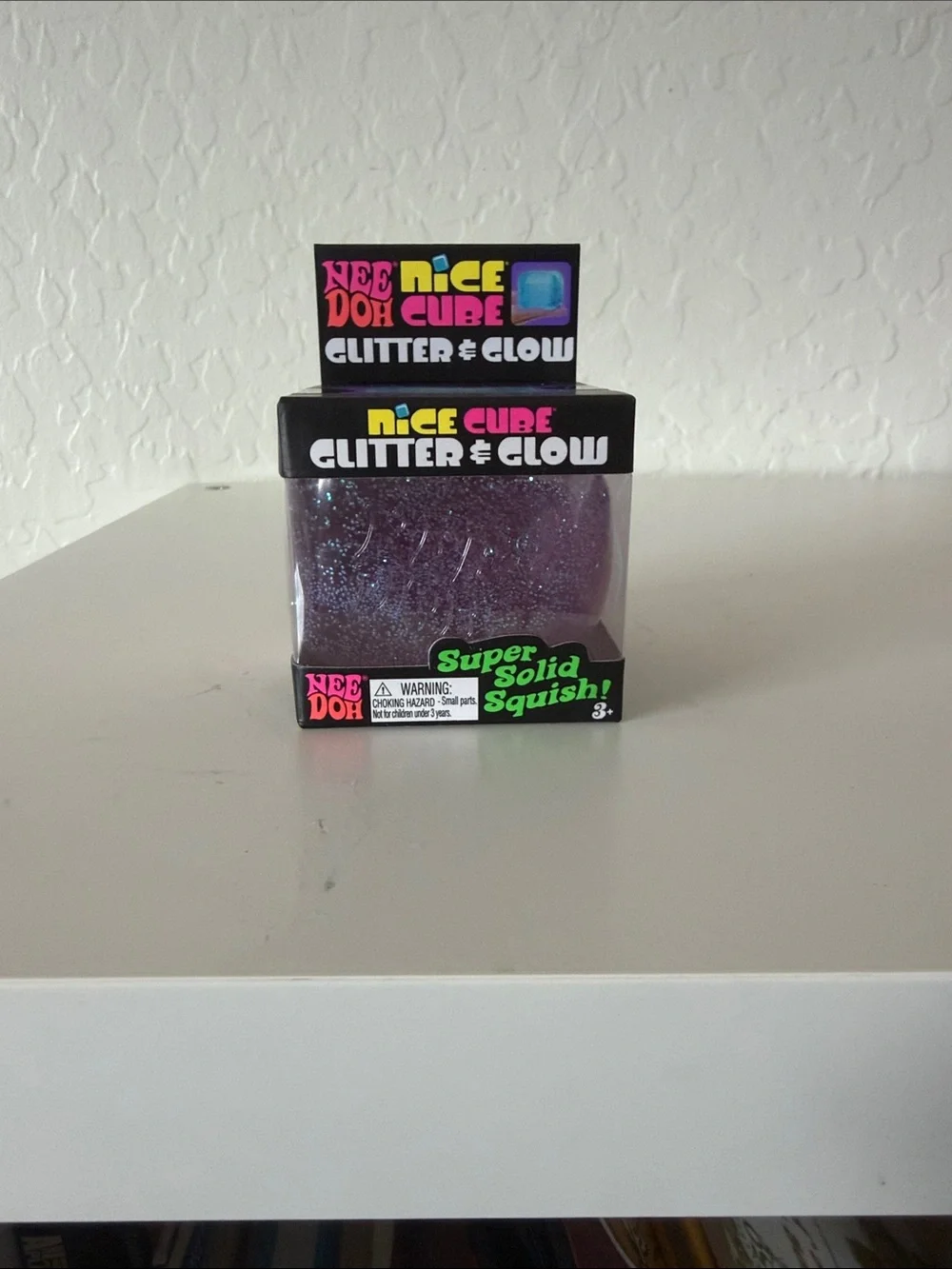 NEW unopened NeeDoh Nice Cube Glitter & Glow. Color purple.